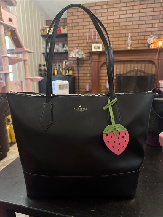 kate spade Handbags - NWOT Kate Spade Black Leather Tote with Pink Strawberry Charm